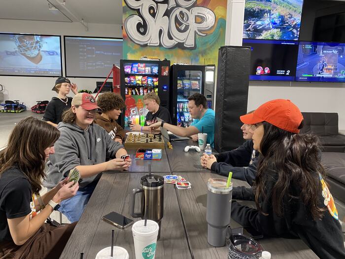 Teens making things together at the craft table