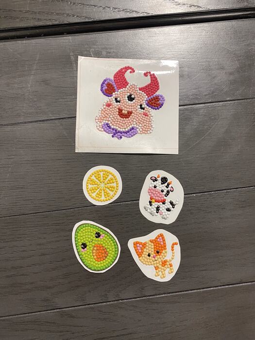 Finished diamond-art stickers laid out
