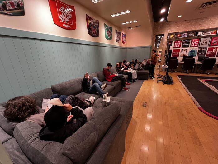 Teens spread out on the couches in the lounge