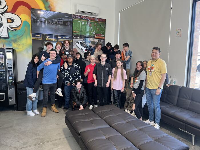 A room full of teens and staff in the Life Shop lounge