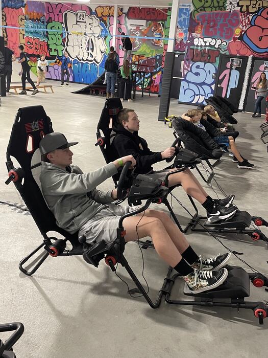 Teens watching a film from the zero-gravity chairs