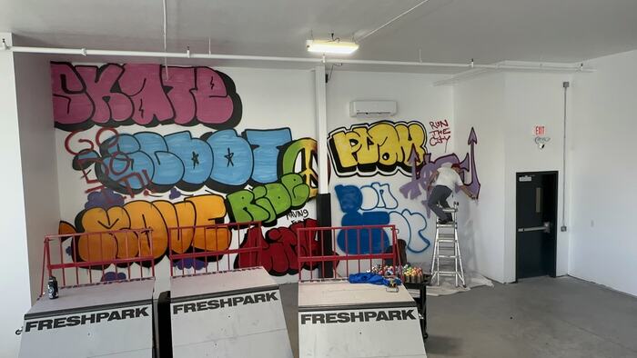 The finished SKATE SCOOT RIDE MOVE PLAY wall