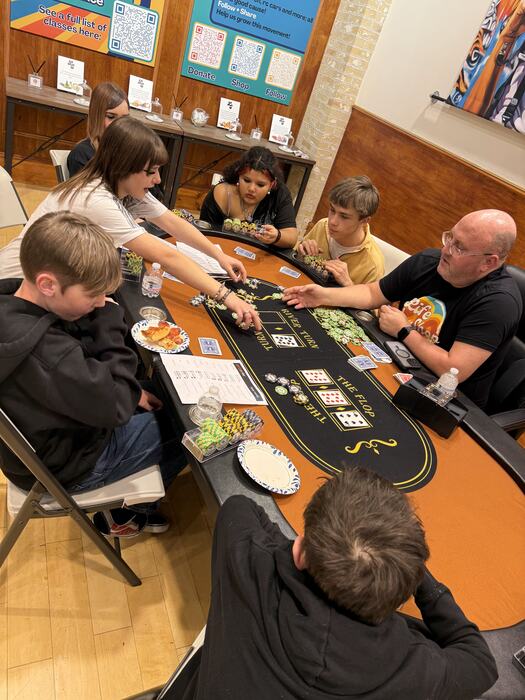 A poker hand being dealt at Life Shop poker night
