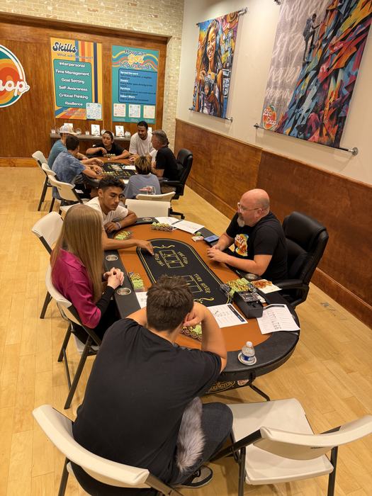 Teens and staff playing poker at Life Shop