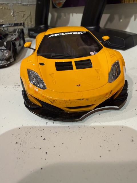 An orange McLaren GT3 RC car