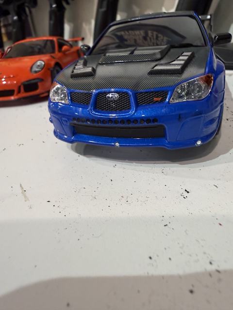 Front view of the blue Subaru Impreza STI RC car