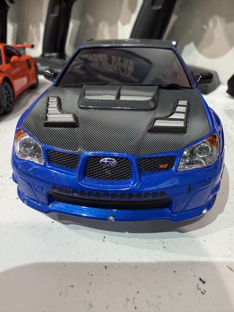 A blue Subaru Impreza STI RC car