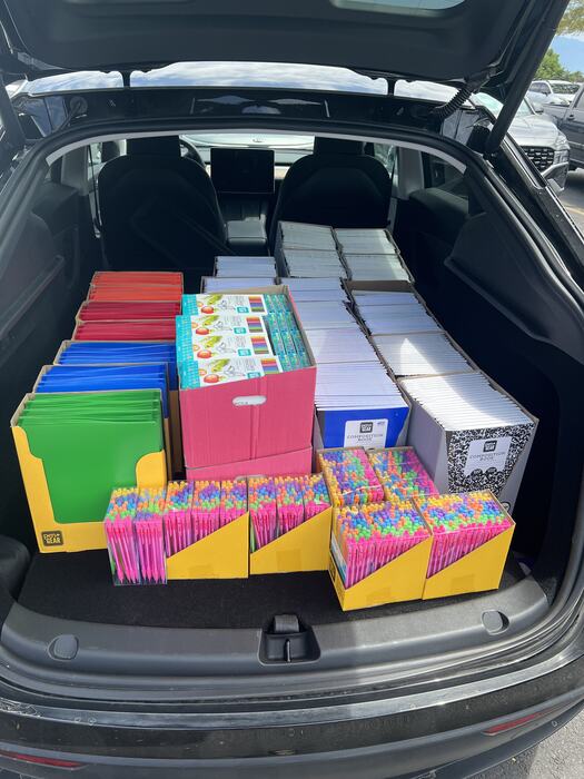 Boxes of notebooks, folders and pencils loaded up for the school supply drive