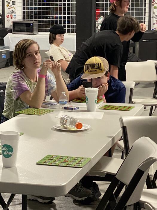 Teens eating together at the tables
