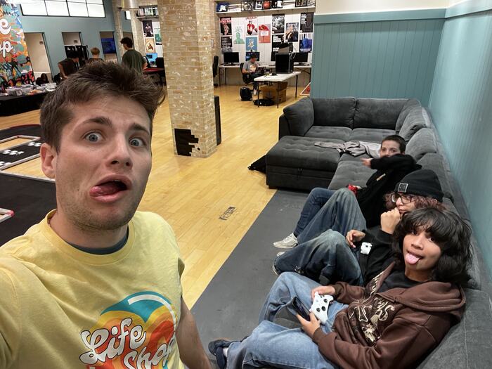 Two teens hanging out on the lounge floor
